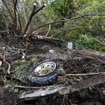 Debris scatters an area, at the site of yesterday's fatal crash Schoharie, N.Y. (Hans Pennink/AP/Shutterstock)